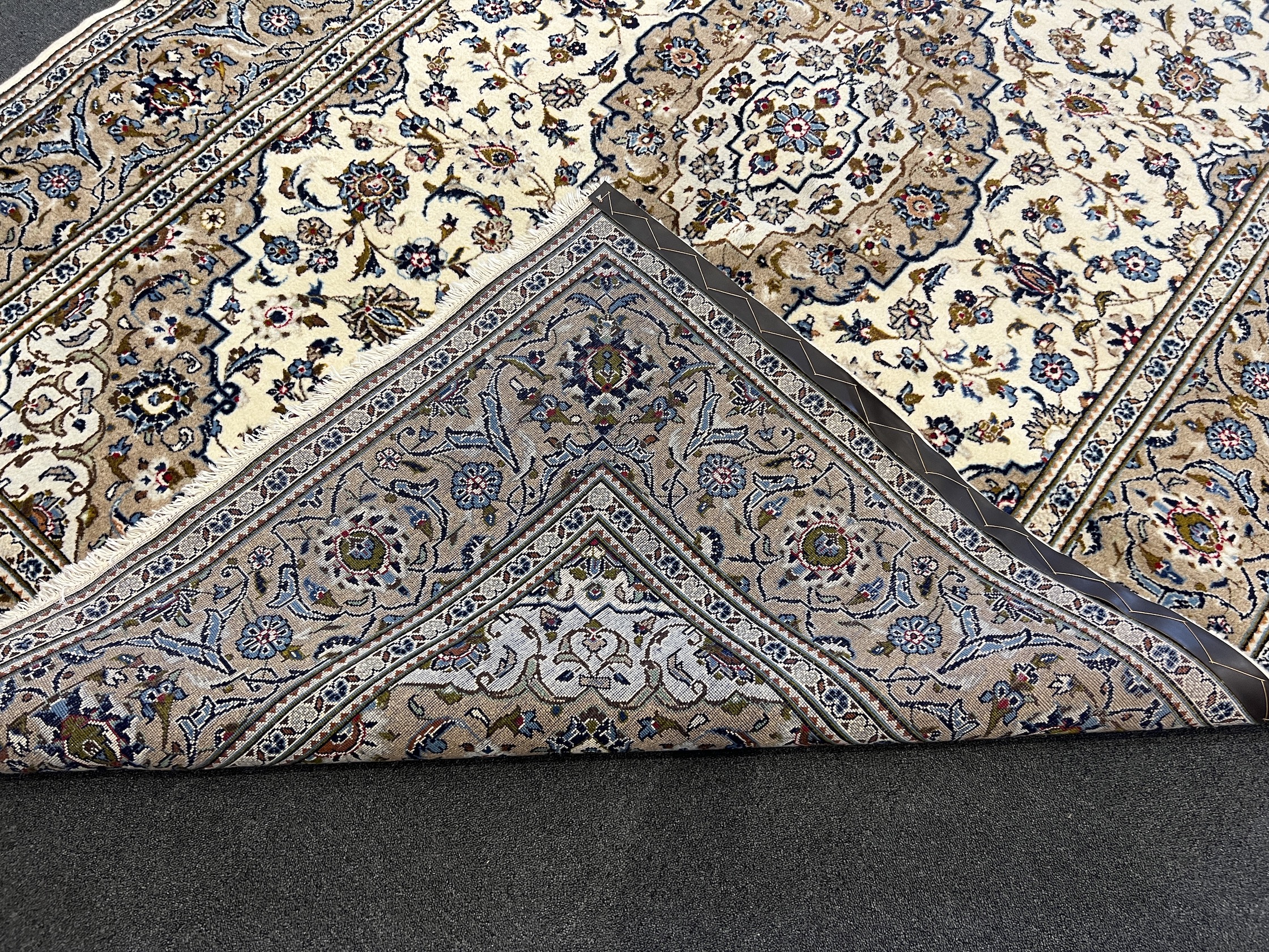 A Kashan ivory ground carpet